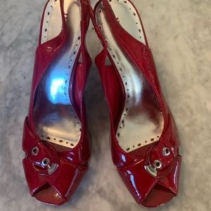 Red faux patent leather high heels